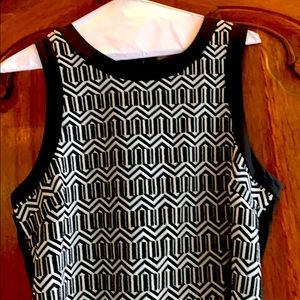Black sleeveless blouse with white embroidery